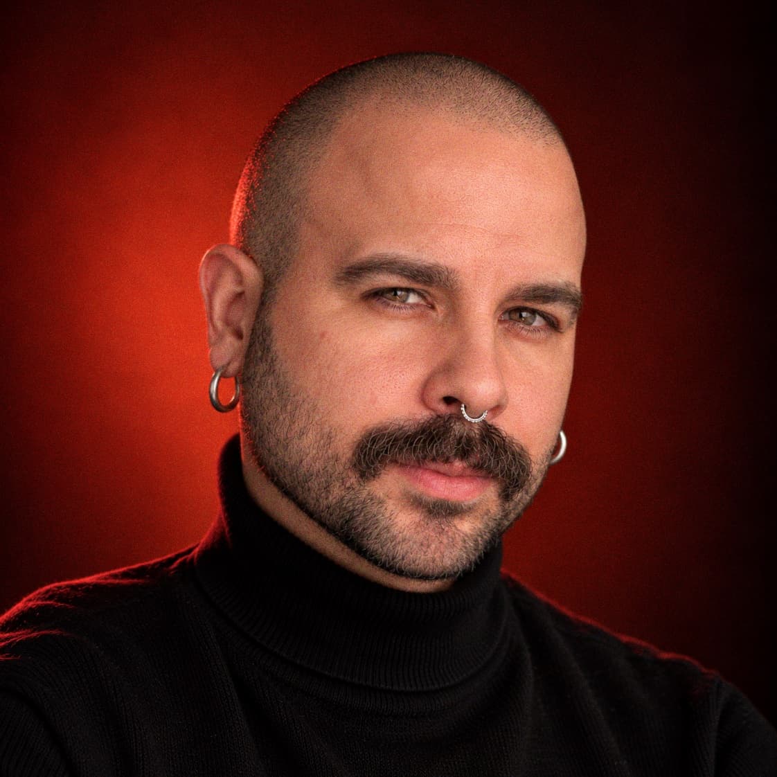 Aaron Nehan, portrait lit in red